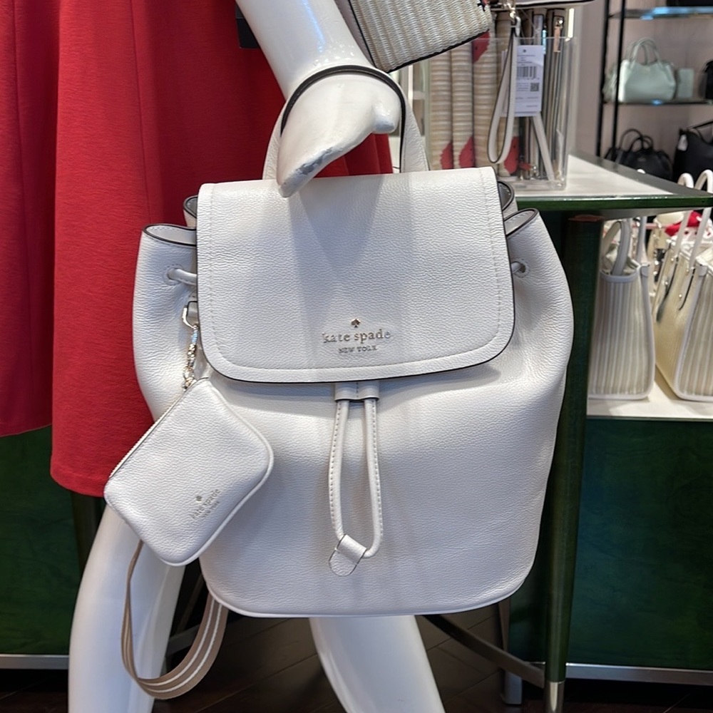 Kate Spade Rosie Medium Flap Backpack 
K8714 pebbled leather Parchment rosie
NWT - Picture 14 of 16